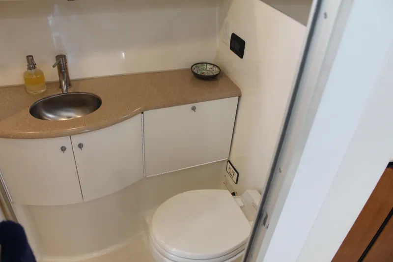 Slide: The Image of 2004 Formula 40 Performance Cruiser bathroom with sink, toilet, and countertop. - 35
