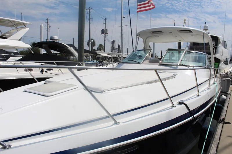 Slide: The Image of 2004 Formula 40 Performance Cruiser docked at marina, sleek design, American flag visible. - 5