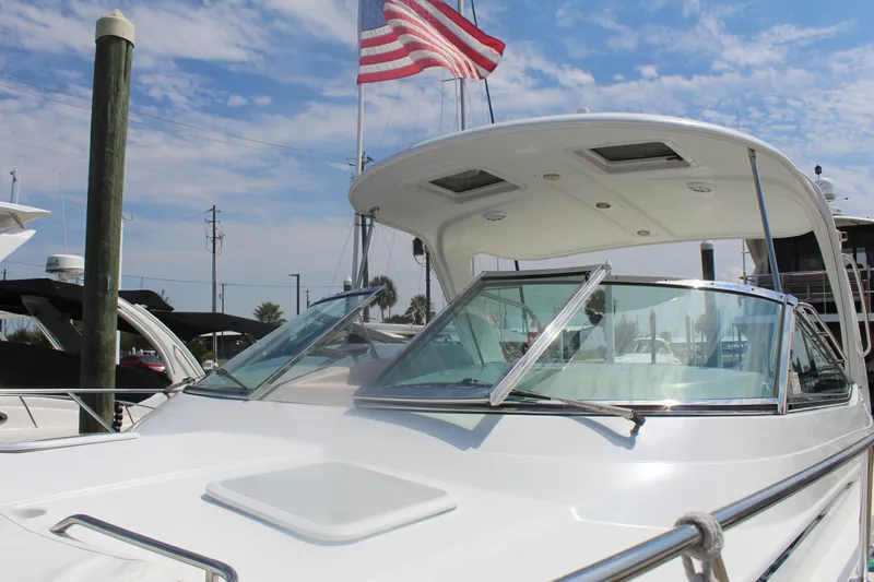 Slide: The Image of 2004 Formula 40 Performance Cruiser docked with American flag in background. - 7