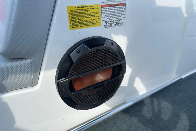 Slide: The Image of Speaker on 2019 MasterCraft NXT20 boat with safety checklist and warning labels. - 14