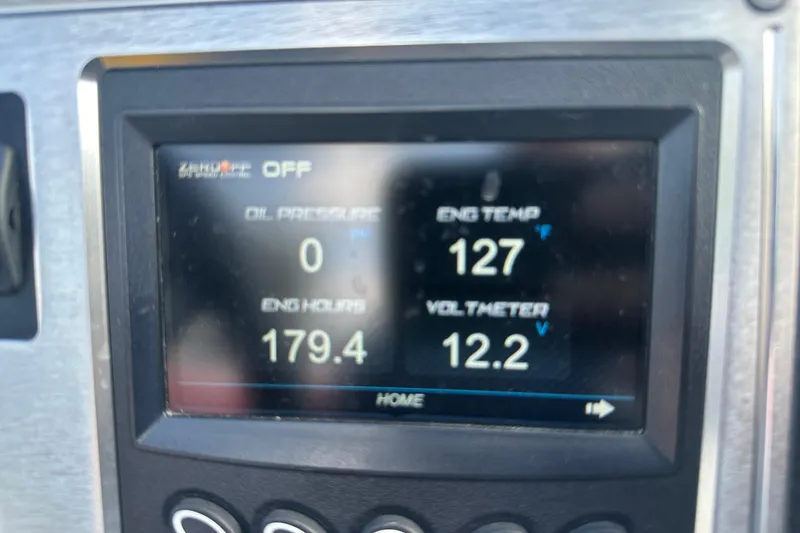 Slide: The Image of Dashboard display of 2019 MasterCraft NXT20 showing engine metrics and settings. - 19