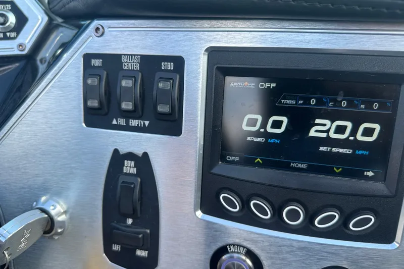 Slide: The Image of Dashboard of a 2019 MasterCraft NXT20 boat with speed controls and ballast switches. - 21
