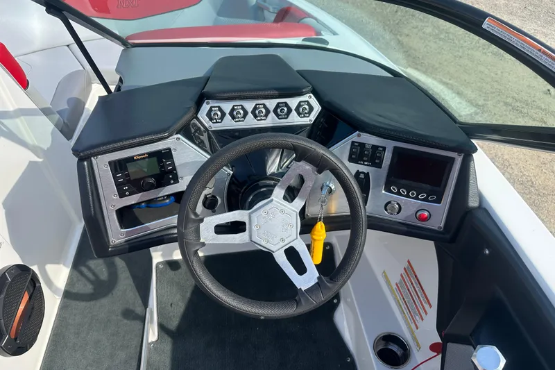 Slide: The Image of 2019 MasterCraft NXT20 boat dashboard with steering wheel and control panel. - 6