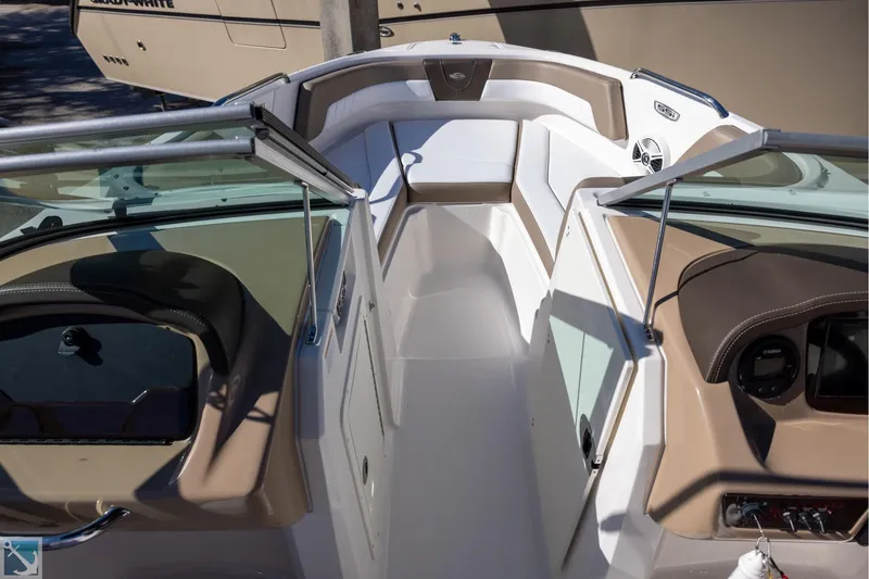 Slide: The Image of 2020 Chaparral 21 SSi OB boat interior with tan and white seating. - 10