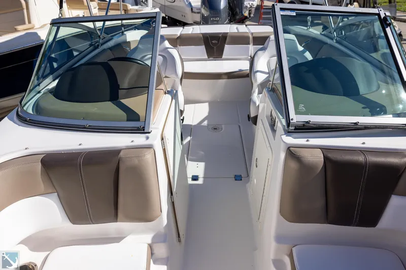 Slide: The Image of 2020 Chaparral 21 SSi OB boat interior with dual windshields and seating. - 12
