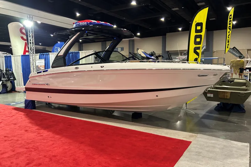 The Image of 2026 Chaparral SSX 6 boat displayed at an indoor exhibition with red carpet. - 0