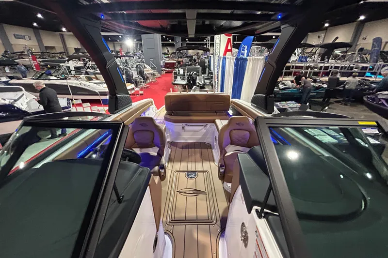Slide: The Image of 2026 Chaparral SSX 6 boat interior at a boat show, showcasing luxury seating and design. - 5