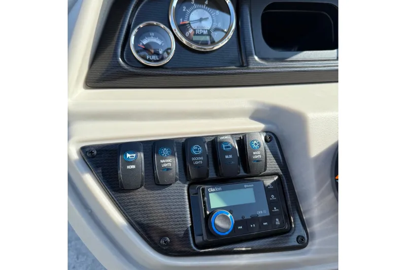 Slide: The Image of Control panel of 2025 Berkshire 24CL 2.75 LE with switches and Clarion audio system. - 12