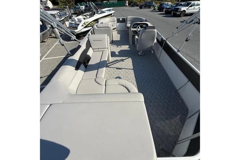 Slide: The Image of 2025 Berkshire 24CL 2.75 LE pontoon boat interior with spacious seating and modern helm. - 9