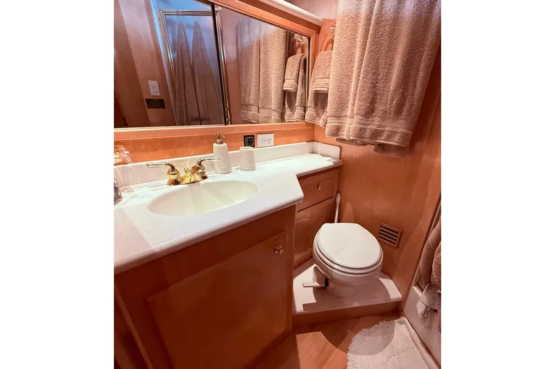 Slide: The Image of Luxurious bathroom in 2000 Navigator 53 yacht with elegant fixtures and plush towels. - 14