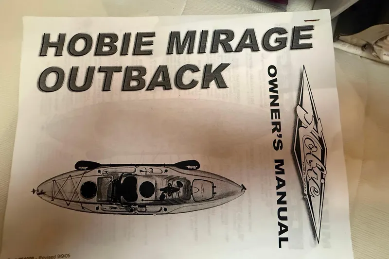 Slide: The Image of Owner's manual for Hobie Mirage Outback kayak, featuring top view illustration. - 16