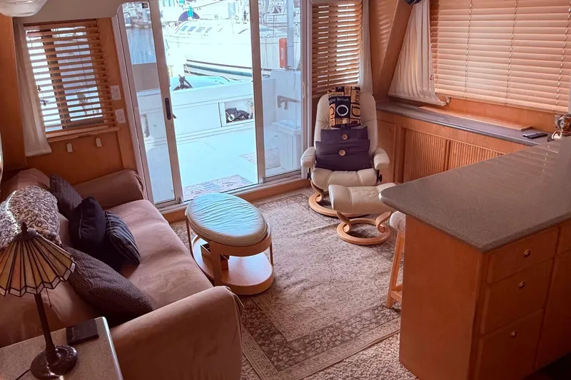 Slide: The Image of Cozy interior of a 2000 Navigator 53 yacht with plush seating and large windows. - 8