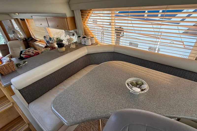 Slide: The Image of Interior of 2000 Navigator 53 yacht with cozy seating and decorative elements. - 9
