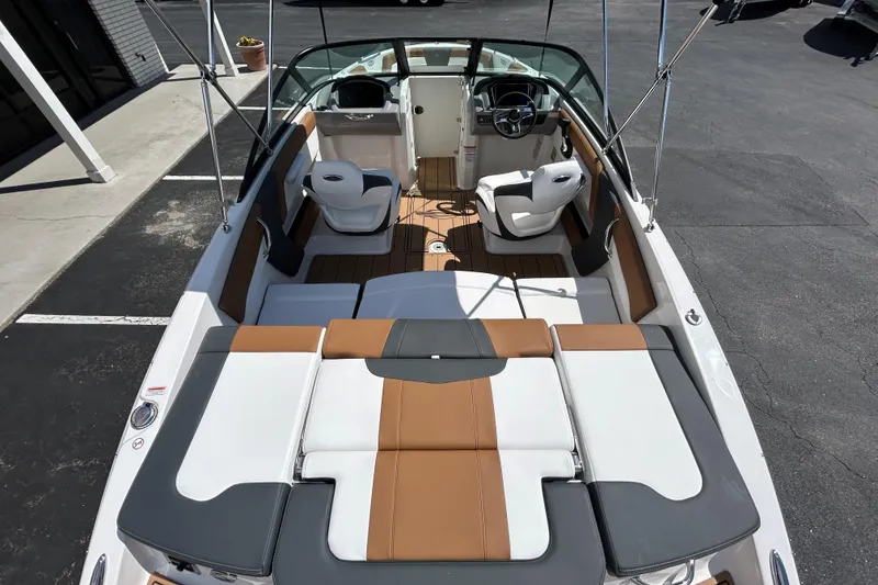 Slide: The Image of 2026 Chaparral 21 SSi boat interior with stylish seating and modern dashboard. - 10