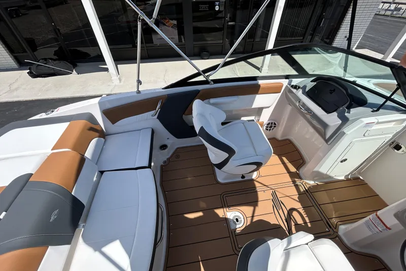 Slide: The Image of Interior of 2026 Chaparral 21 SSi boat with stylish seating and modern dashboard. - 5