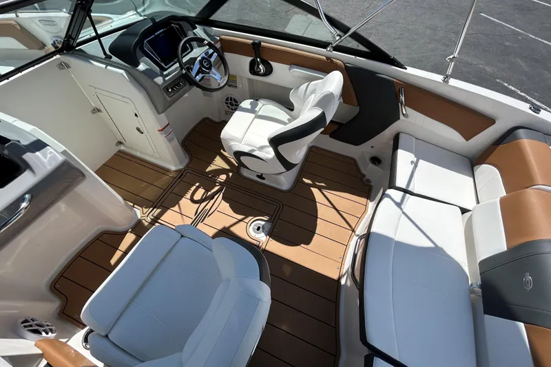 Slide: The Image of Interior of 2026 Chaparral 21 SSi boat with modern seating and steering wheel. - 6