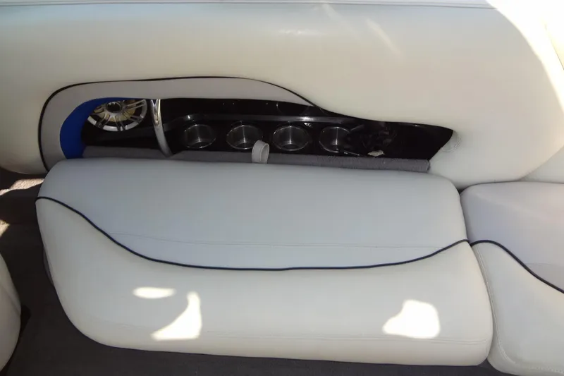 Slide: The Image of 2007 Malibu Wakesetter 23 LSV interior with white seating and built-in cup holders. - 21