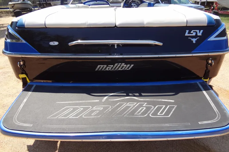 Slide: The Image of 2007 Malibu Wakesetter 23 LSV boat rear view with logo and swim platform. - 23