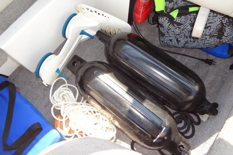 Slide: The Image of Boat storage area with fenders, ropes, and gear on a 2007 Malibu Wakesetter 23 LSV. - 27
