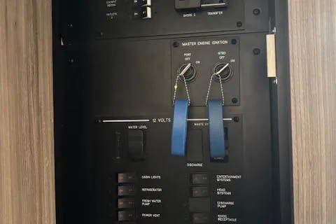 Slide: The Image of Electrical control panel on a 2024 Sea Ray Sundancer 320 boat. - 17