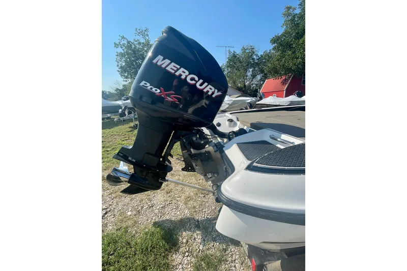 Slide: The Image of 2012 Triton 21 XS Elite boat with Mercury Pro XS outboard motor. - 7