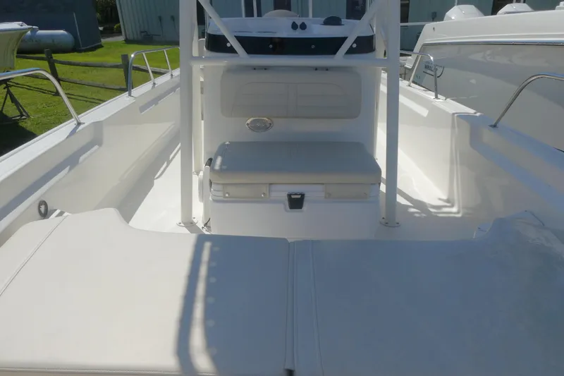 Slide: The Image of 2022 Boston Whaler 190 Montauk boat interior with seating and storage. - 11