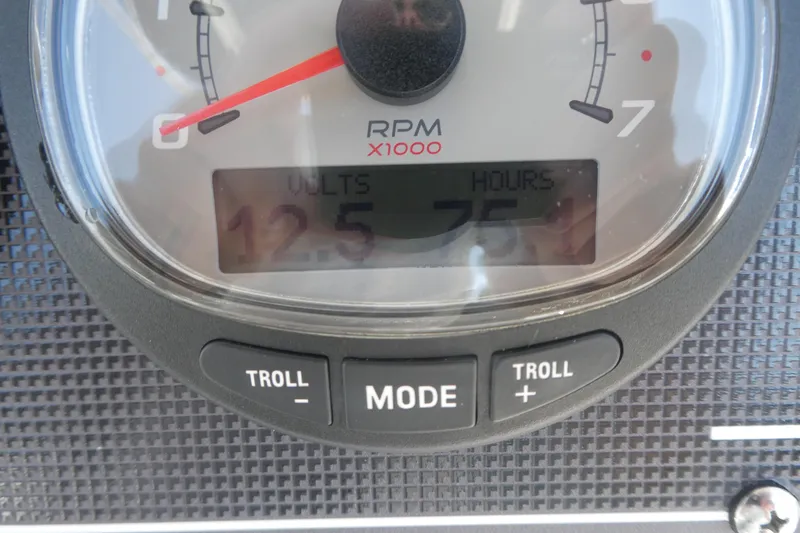 Slide: The Image of Close-up of 2022 Boston Whaler 190 Montauk boat gauge displaying RPM, volts, and hours. - 12