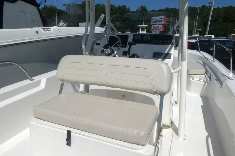 Slide: The Image of 2022 Boston Whaler 190 Montauk boat interior with steering console and seating. - 4