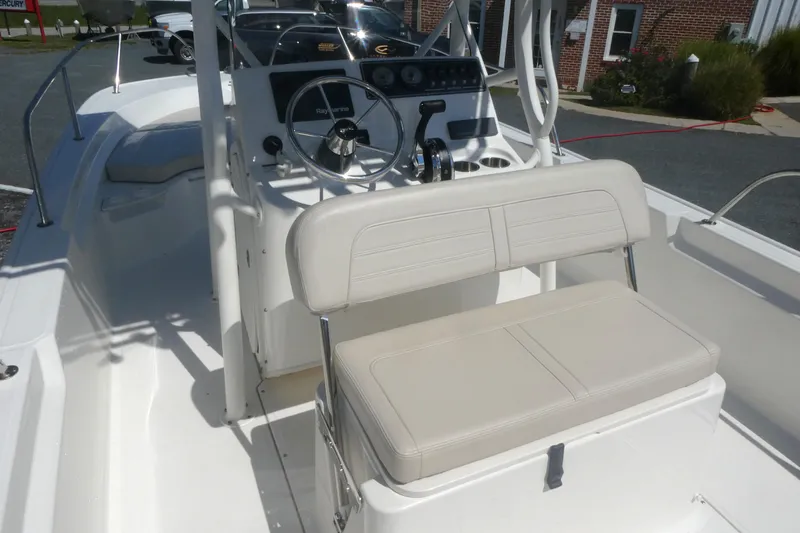 Slide: The Image of 2022 Boston Whaler 190 Montauk boat interior with steering console and seating. - 7
