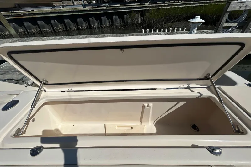 Slide: The Image of Open storage compartment on a 2020 Grady-White Canyon 306 boat. - 13