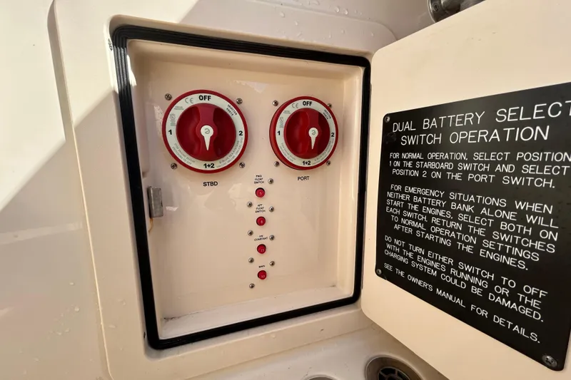 Slide: The Image of Dual battery selector switches on 2020 Grady-White Canyon 306 boat with operation instructions. - 14