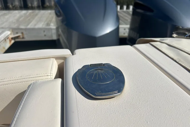 Slide: The Image of 2020 Grady-White Canyon 306 boat detail with metal latch and twin engines. - 16