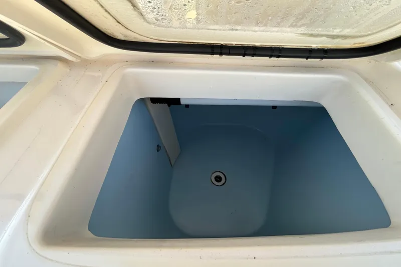 Slide: The Image of Livewell compartment of 2020 Grady-White Canyon 306 boat, open and empty. - 20