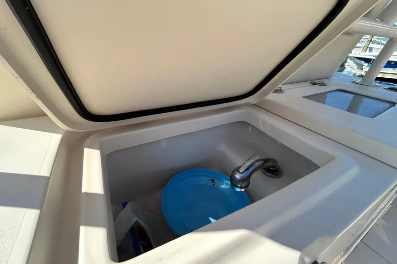 Slide: The Image of Grady-White Canyon 306 boat sink with blue dish, 2020 model. - 21