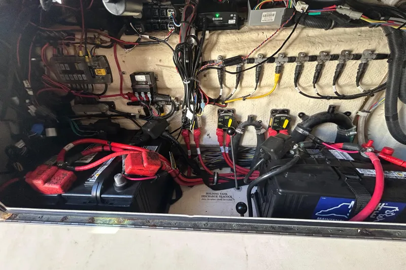 Slide: The Image of Electrical system of a 2020 Grady-White Canyon 306 boat, featuring batteries and wiring. - 32