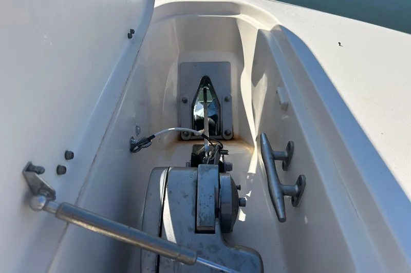 Slide: The Image of 2020 Grady-White Canyon 306 anchor compartment with winch and cleats. - 39