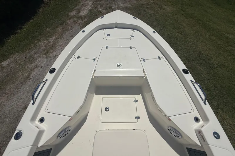 Slide: The Image of 2026 Pathfinder 2200 TRS boat deck with storage compartments and sleek design. - 16