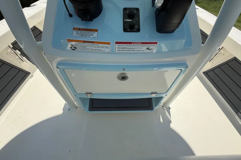 Slide: The Image of 2026 Pathfinder 2200 TRS boat console with controls and warning labels. - 31