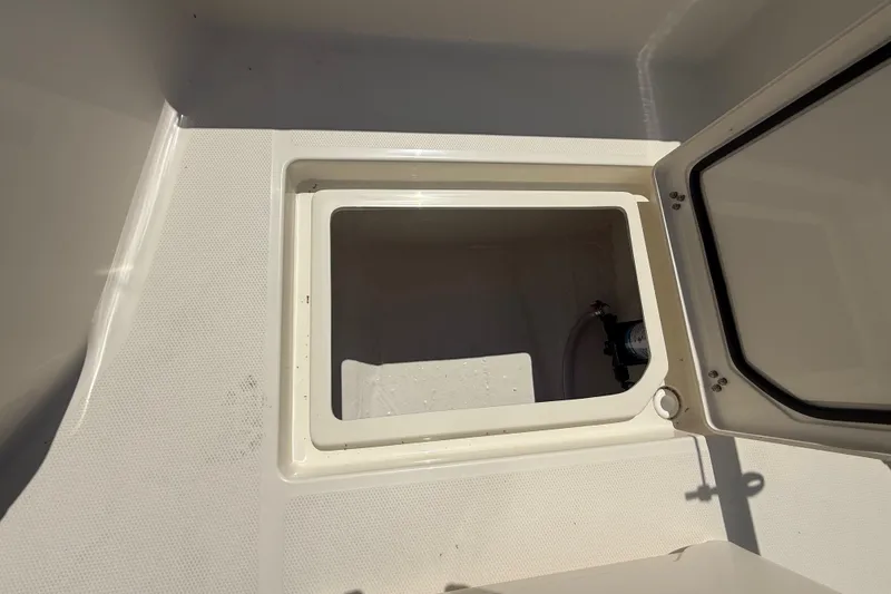 Slide: The Image of Open storage compartment on 2026 Pathfinder 2200 TRS boat. - 39