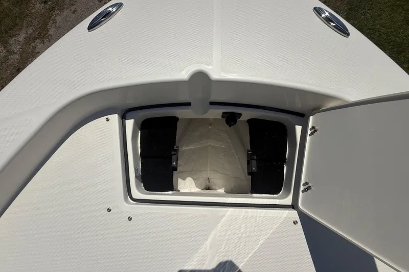Slide: The Image of Open storage compartment on 2026 Pathfinder 2200 TRS boat deck. - 42