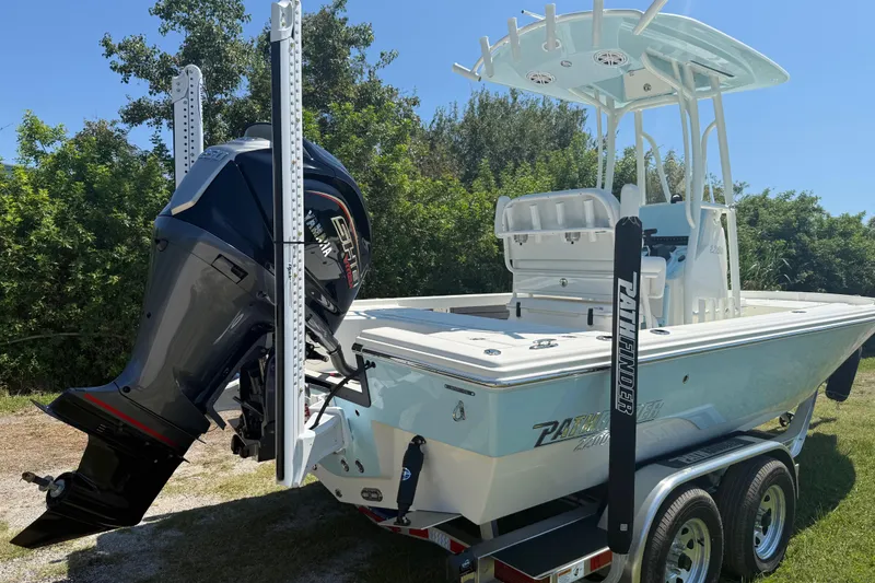 Slide: The Image of 2026 Pathfinder 2200 TRS boat with Yamaha outboard motor on trailer, surrounded by greenery. - 5