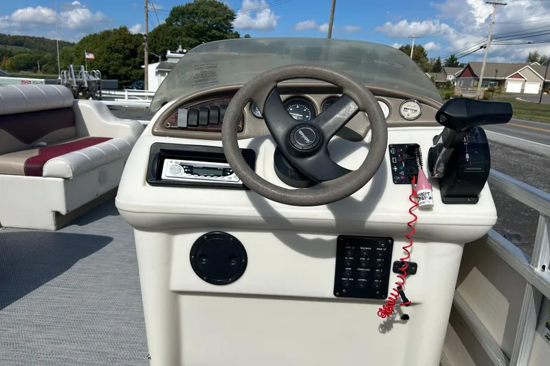 Slide: The Image of Boat interior with steering console and cushioned seat, Sweet Water 2019RE model, 2003. - 28