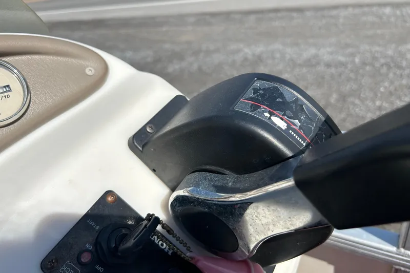 Slide: The Image of Pontoon boat interior with steering console and cushioned seat, SWEET WATER 2019RE model. - 29