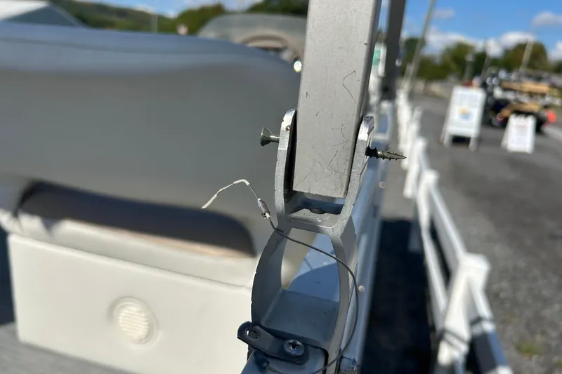 Slide: The Image of Captain's chair on a 2003 Sweetwater 2019RE boat, featuring white and maroon upholstery. - 30