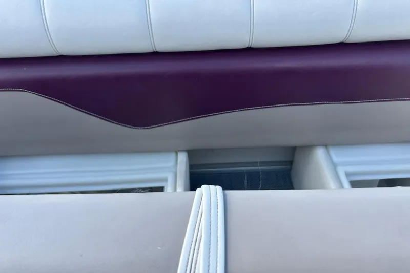 Slide: The Image of White and maroon boat seat from a 2003 SWEET WATER 2019RE model. - 46