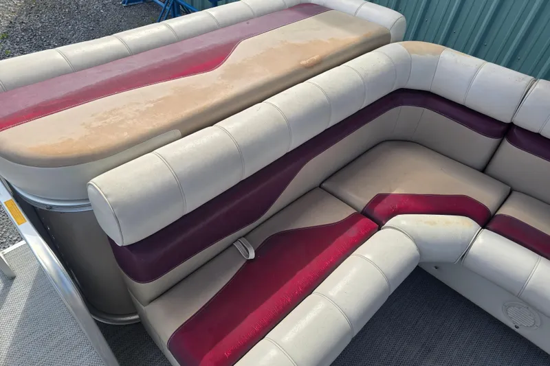 Slide: The Image of Sweetwater 2019RE pontoon boat with Honda motor, parked outdoors. - 5