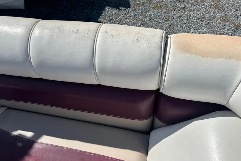 Slide: The Image of Worn boat seating on a 2003 SWEET WATER 2019RE, showing discoloration and wear. - 51