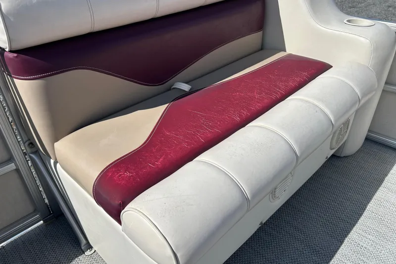 Slide: The Image of Worn Sweetwater 2019RE boat seat upholstery, showing discoloration and wear, 2003 model. - 55