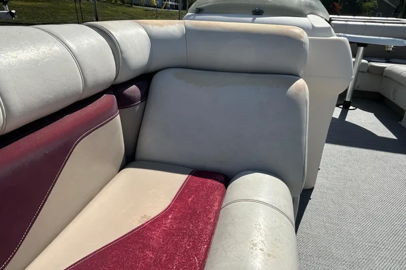 Slide: The Image of Worn Sweetwater 2019RE boat seat with visible stitching and discoloration, model year 2003. - 58