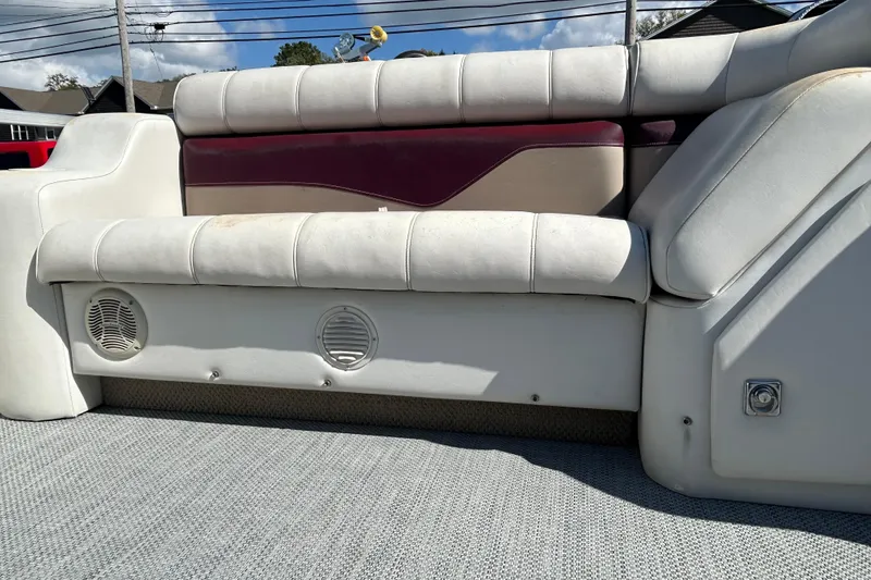 Slide: The Image of Cream and burgundy boat seat from a 2003 Sweetwater 2019RE model. - 61